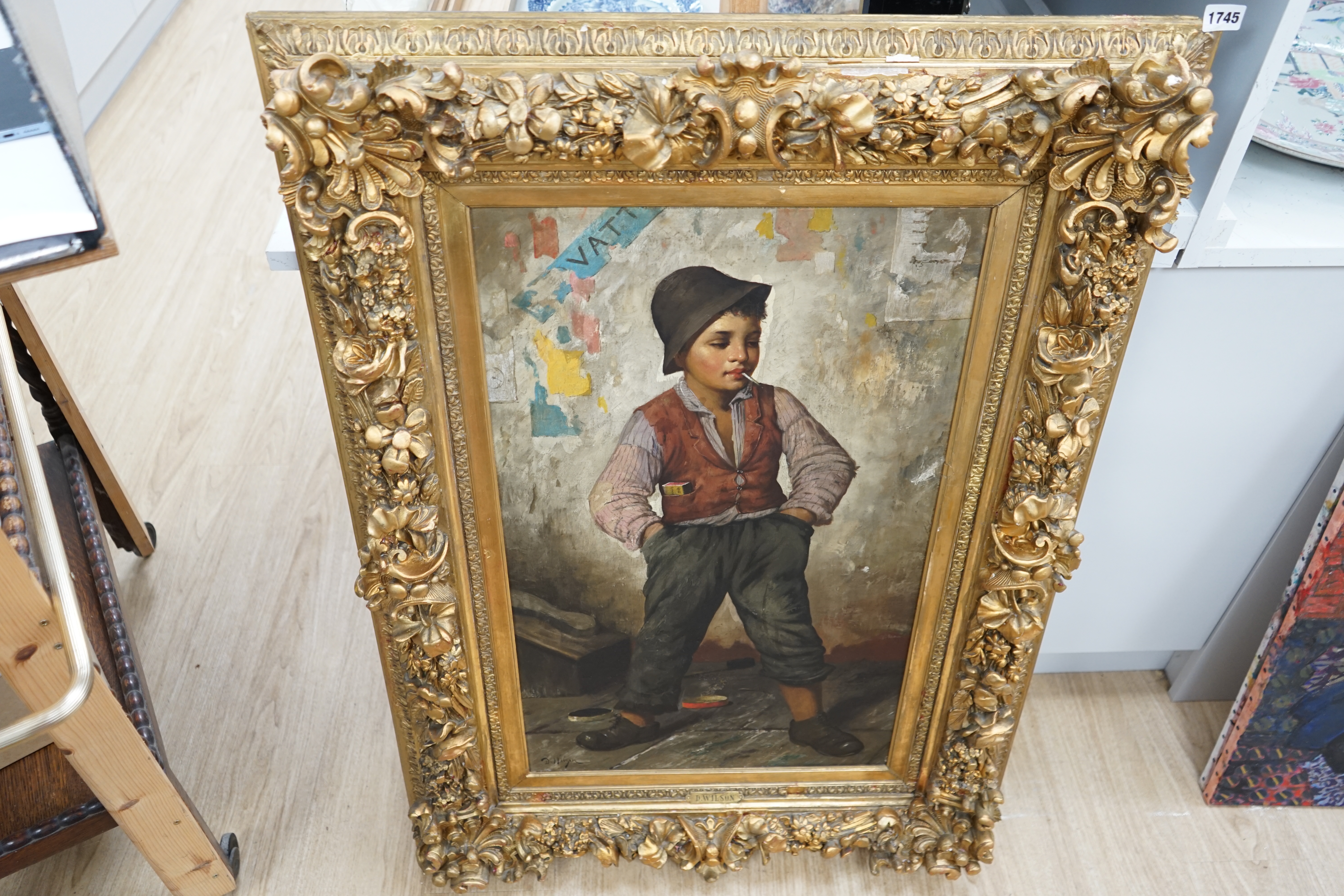 D. Wilson (19th C.), oil on canvas, Full length study of a boy smoking, signed, applied plaque to the frame, 79 x 48cm, ornate gilt framed. Condition - fair, losses to the frame